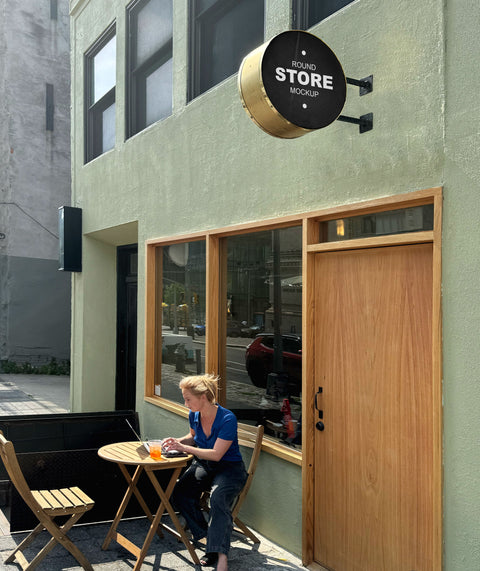 "Brooklyn storefront sign mockup with polished brass surround" and "woman at outdoor cafe with round store sign."