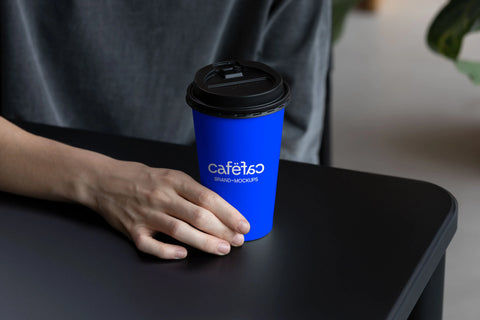 Hand holding Takeaway Coffee Cup Mockup