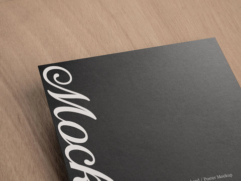 Letterhead or Poster PSD Mockup Detail Shot on a wood grain background 'House of Mockups'