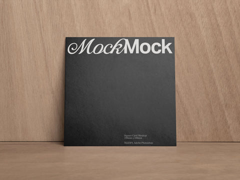 Square Card of Poster PSD Mockup shot on a wood grain background 'House of Mockups'