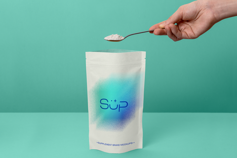 Hand spooning protein powder out of packaging mockup